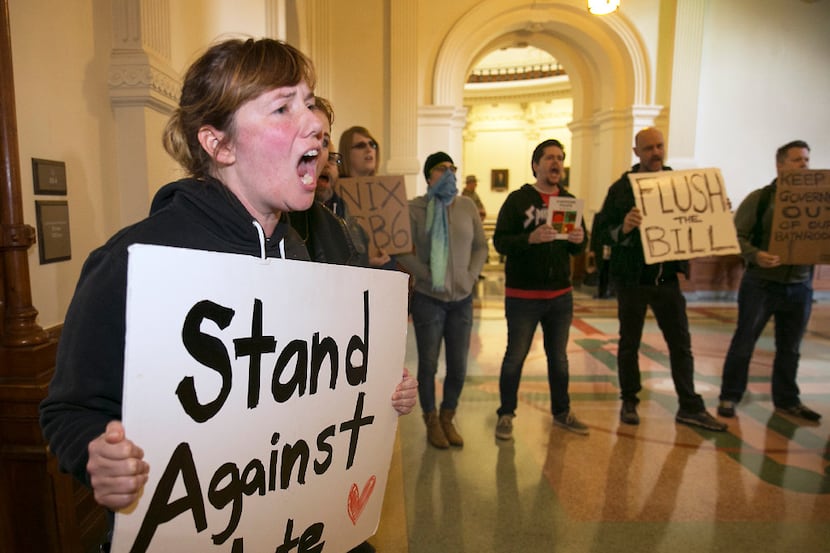 Protesters try to drown out a press conference with Texas Lt. Gov. Dan Patrick and Sen. Lois...