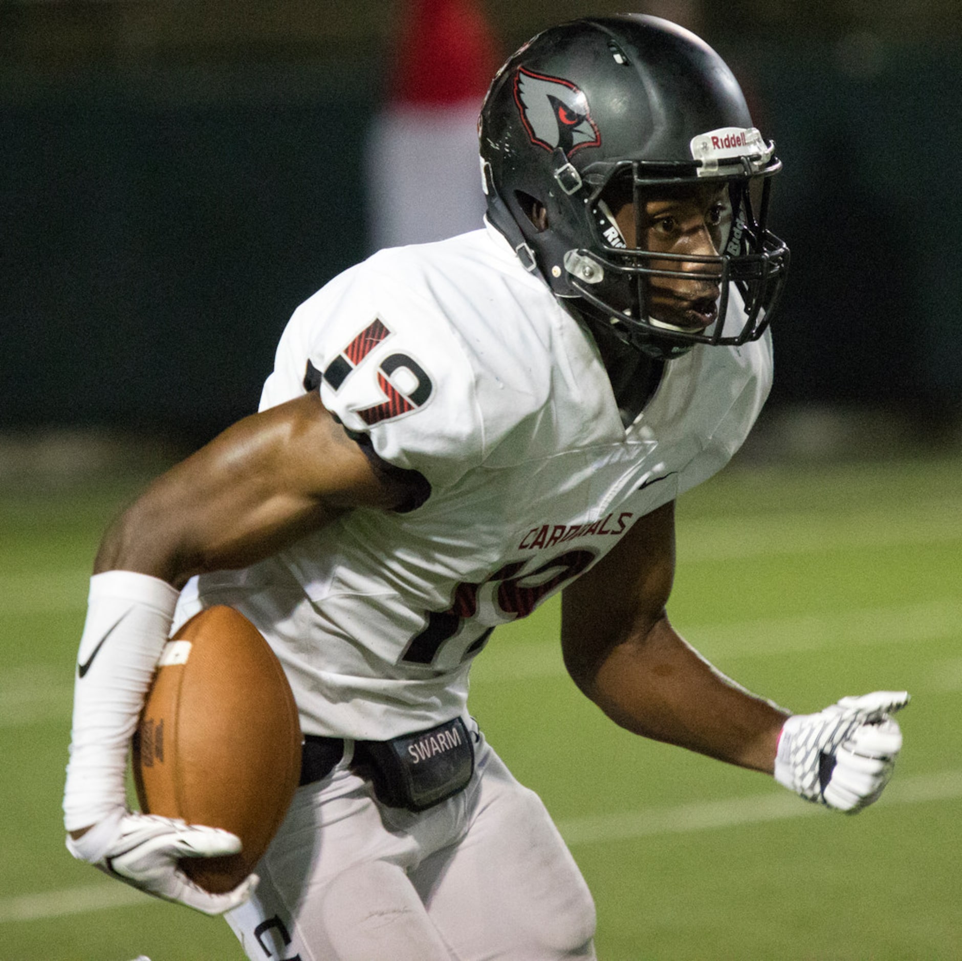 Irving MacArthur wide receiver Charles Sherman (19) returns a kickoff during a District 7-6A...