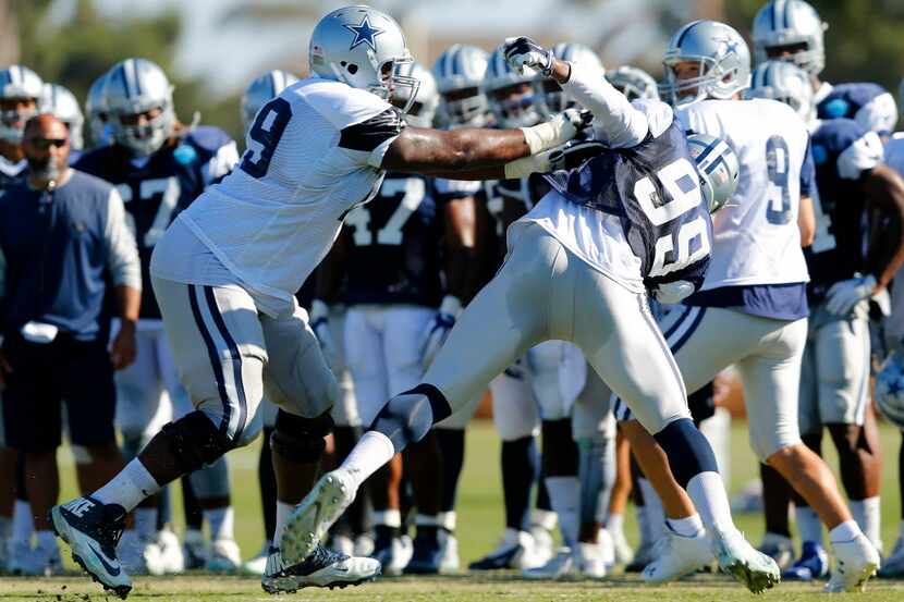 Dallas Cowboys offensive tackle Chaz Green (79) battles defensive end Ryan Russell (99)...