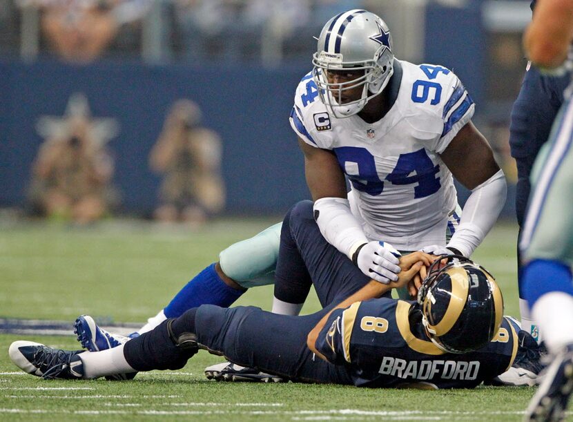 Dallas Cowboys defensive end DeMarcus Ware (94) breaks a Dallas Cowboys sack record with...