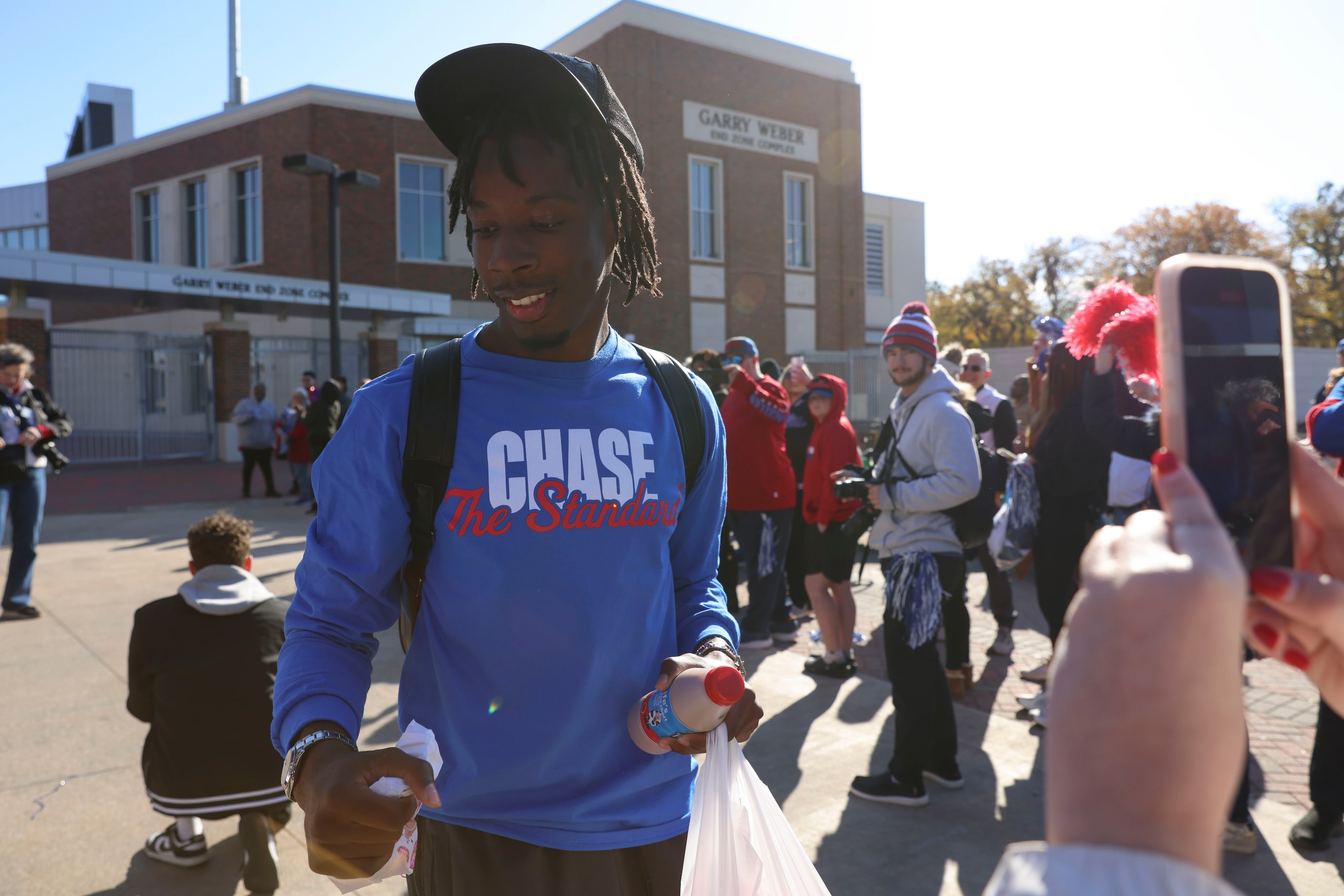 SMU QB Kevin Jennings makes his way out during a send-off party for the football team ahead...