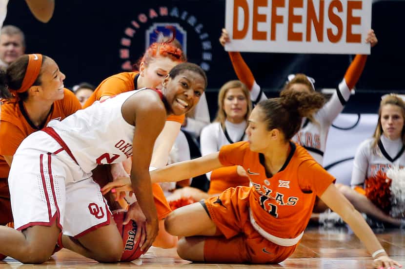 Oklahoma Sooners guard Sharane Campbell-Olds (24) fights for the ball with Texas Longhorns...