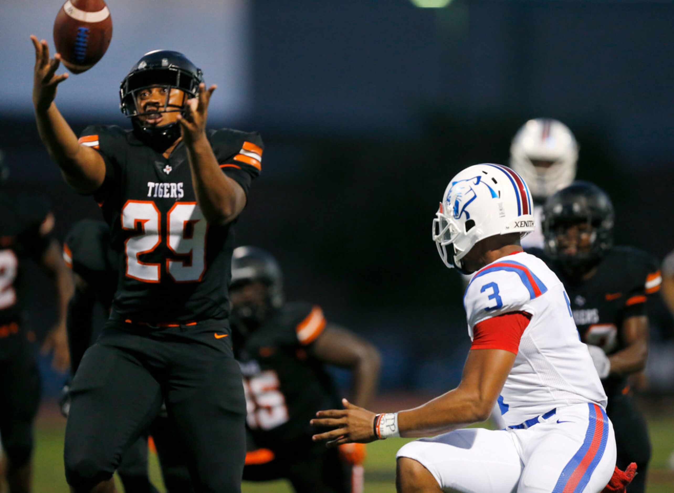 Duncanville quarterback Ja'Quinden Jackson (3) lost the grip on the ball turning it over to...