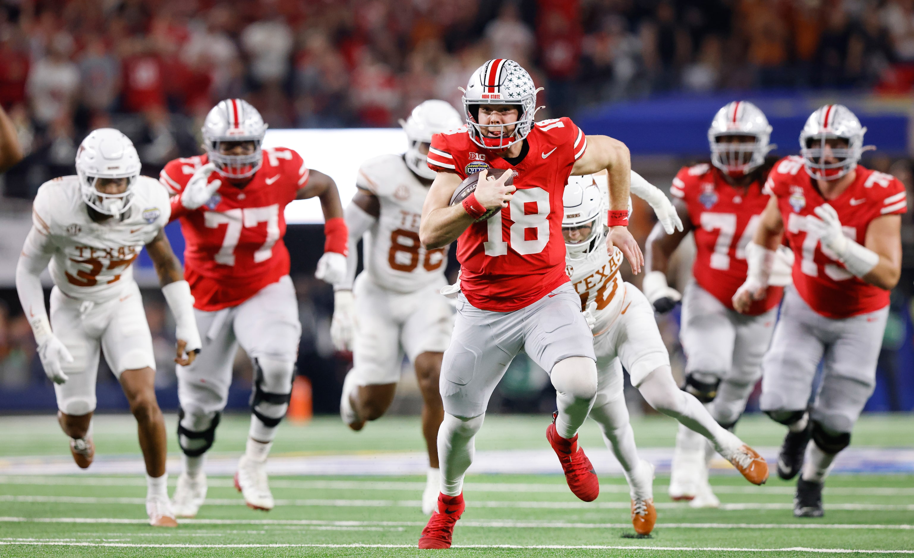 Ohio State Buckeyes quarterback Will Howard (18) found room the run as he picked up a big...