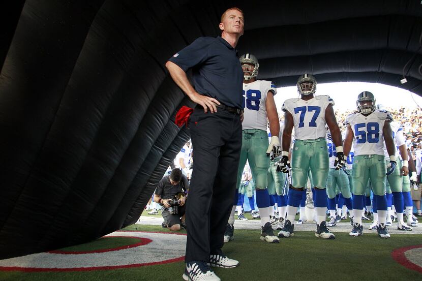 Dallas Cowboys head coach Jason Garrett waits in the tunnel with his players before being...
