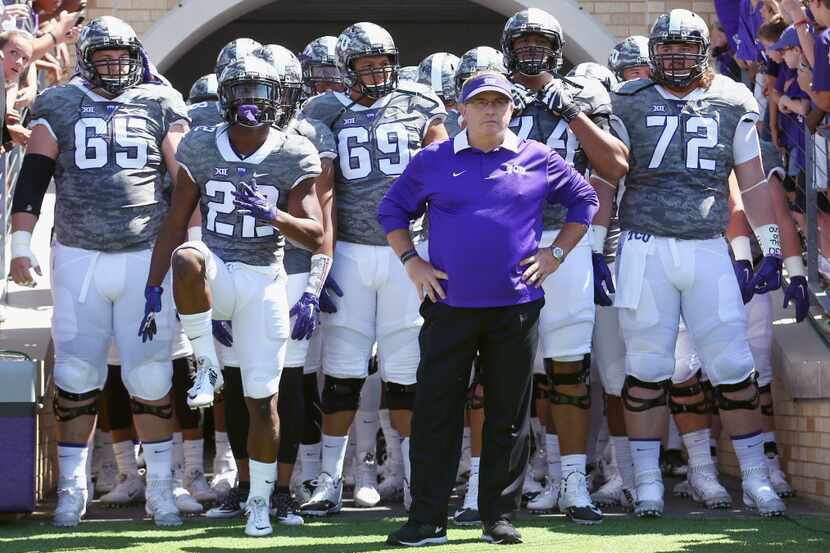 Head coach Gary Patterson of the TCU Horned Frogs leads his team onto the field to take on...