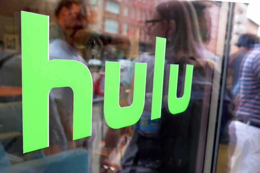 FILE - This June 27, 2015, file photo, shows the Hulu logo on a window at the Milk Studios...