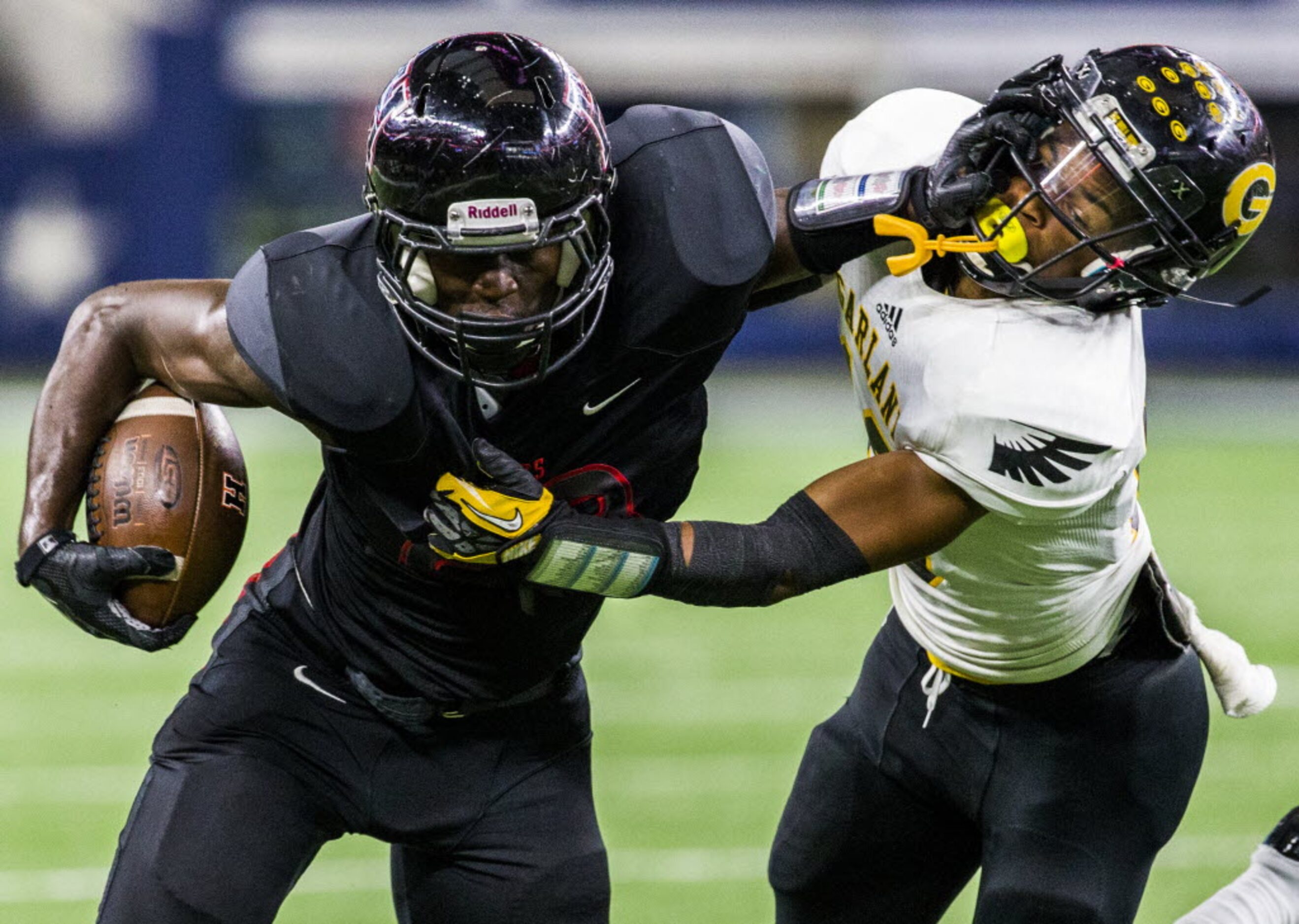 Garland defensive back Josh Thompson (10) gets pushed away as he tackles Rockwall-Heath's...