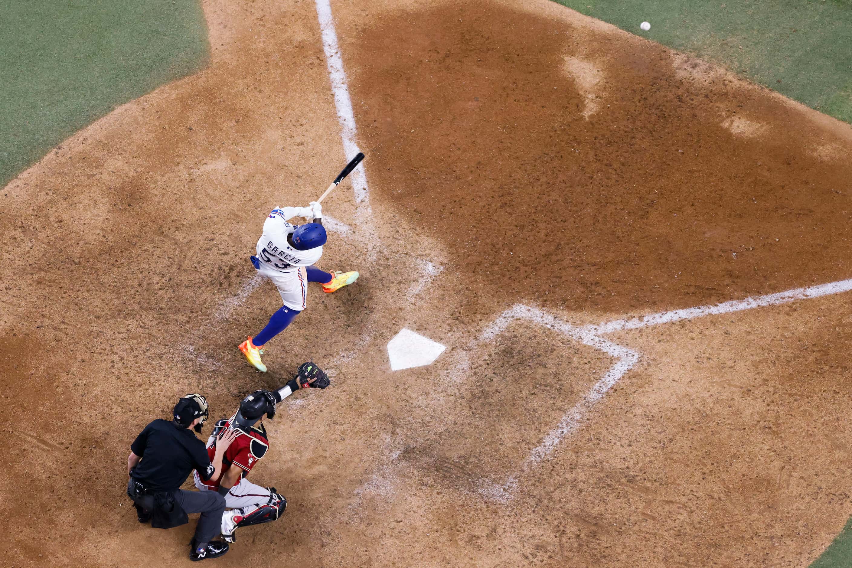 Texas Rangers' Adolis Garcia hits a walk-off home run during the eleventh inning in Game 1...