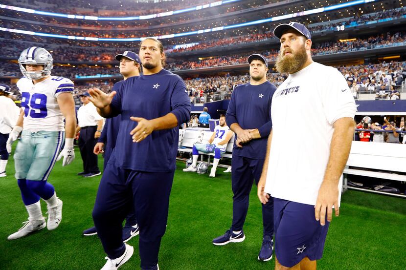 Dallas Cowboys center Travis Frederick (right) is still out, suffering with Guillain-BarrÃ©...