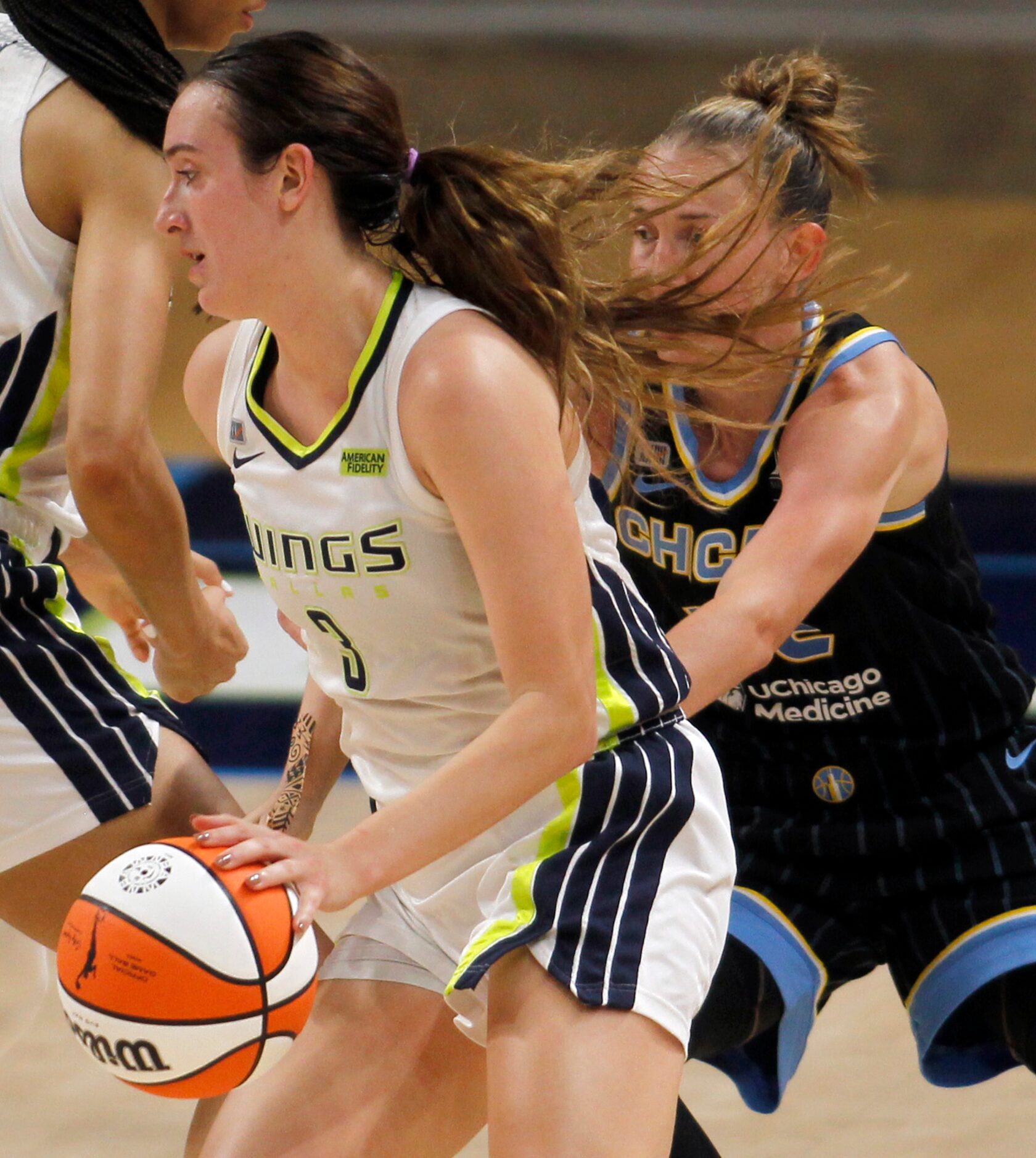 Dallas Wings guard Marina Mabrey (3) drives the lane as Chicago Sky Courtney Vandersloot...