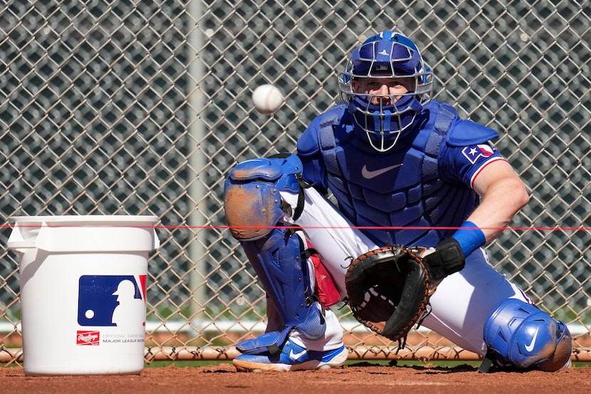 Texas Rangers catcher Sam Huff works in the bullpen during a spring training workout at the...