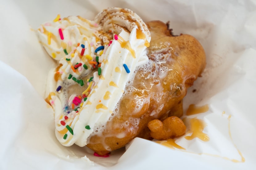 Fried Capirotada or Fried Mexican Bread Pudding, at one of the Garza family food booths at...