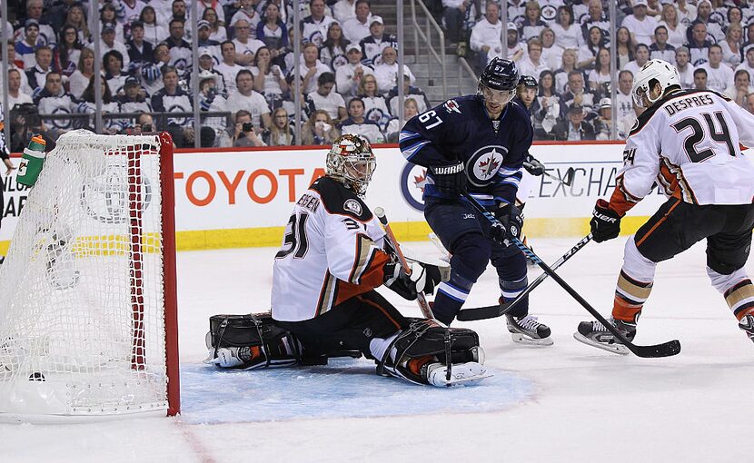 WINNIPEG, MB - APRIL 20: Frederik Andersen #31 of the Anaheim Ducks looks behind him as...