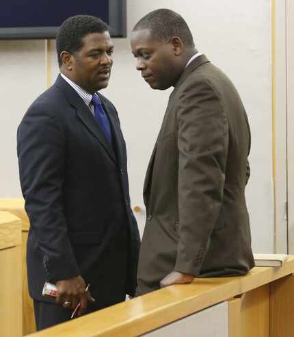  Heath Harris (left), then-first assistant DA, talks to then-DA Craig Watkins at Crowley...