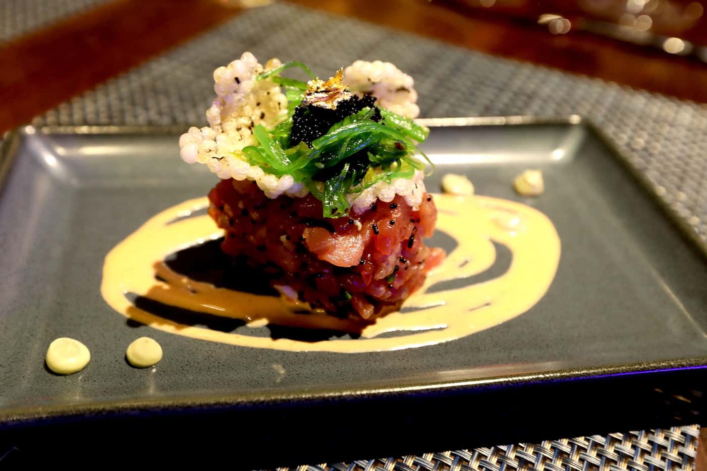 Tuna tartare with avocado mousse, wakame, crispy peal, tobiko and dashi soy reduction at The...