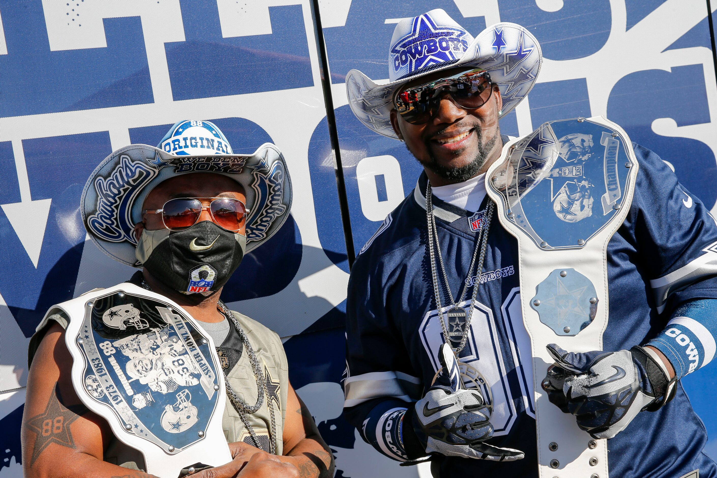 Galen Billington, 49 (left), and Jeff Sheppard, 48, pose for a photo before an NFL football...