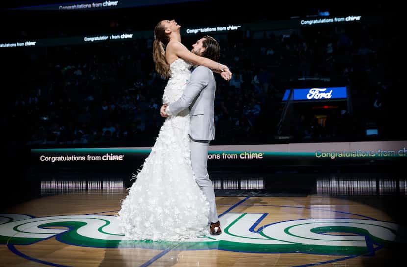 Reid Malone and his bride Ellyn Nichole Piatt share their first dance after they were wed at...