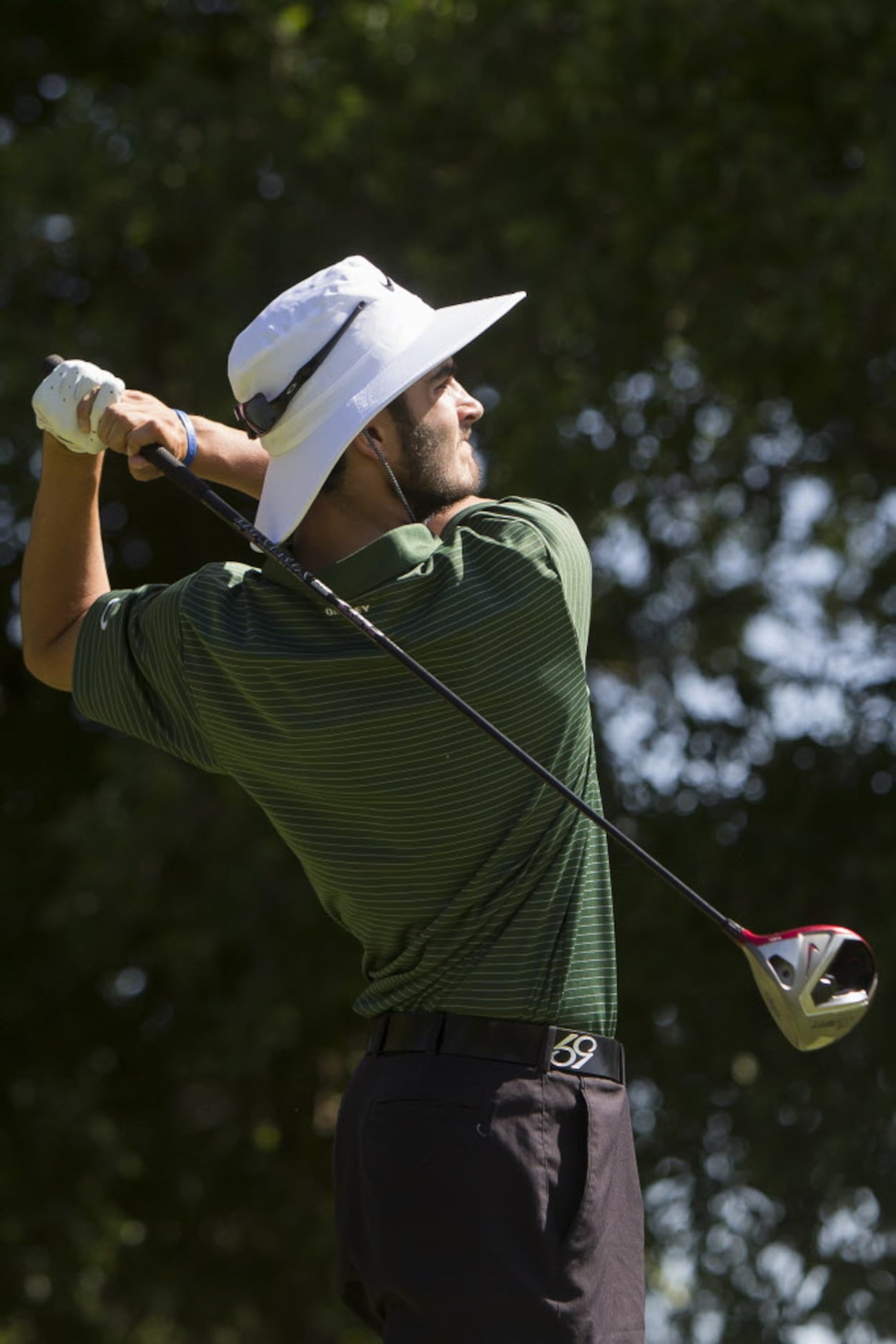 Southlake Carroll junior Trent Hill makes a drive on the fifth hole during the UIL 5A State...