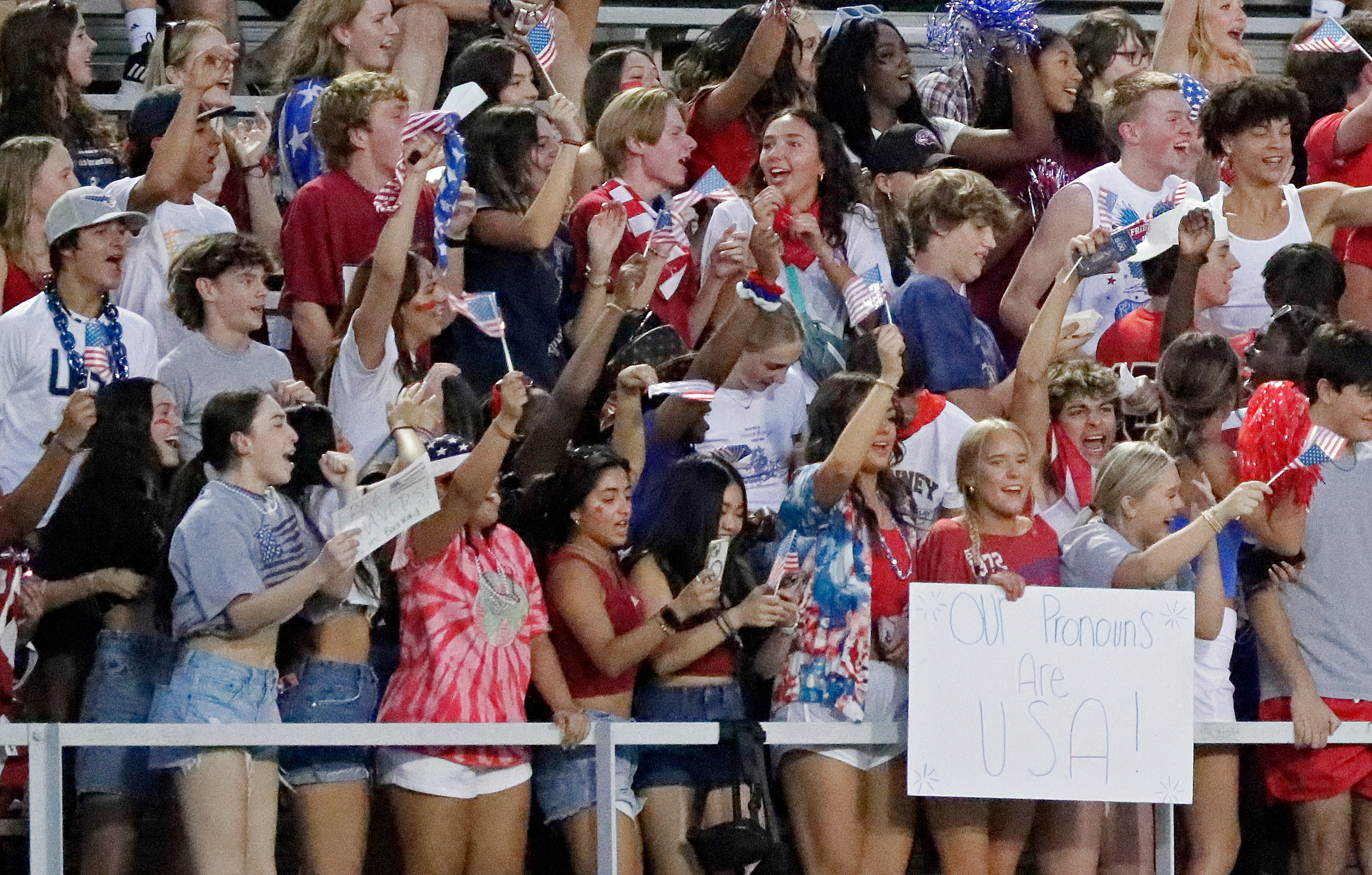 McKinney High School students celebrate a touchdown during the first half as Berkner High...