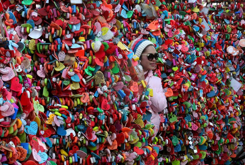 "Love locks" adorn the Namsan Seoul Tower, which rises 777 feet above the 800-foot-high...