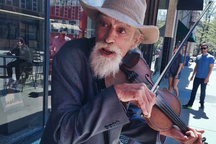 This musician, who goes by the name  Mikey, fiddles and plays authentic Appalachian tunes on...