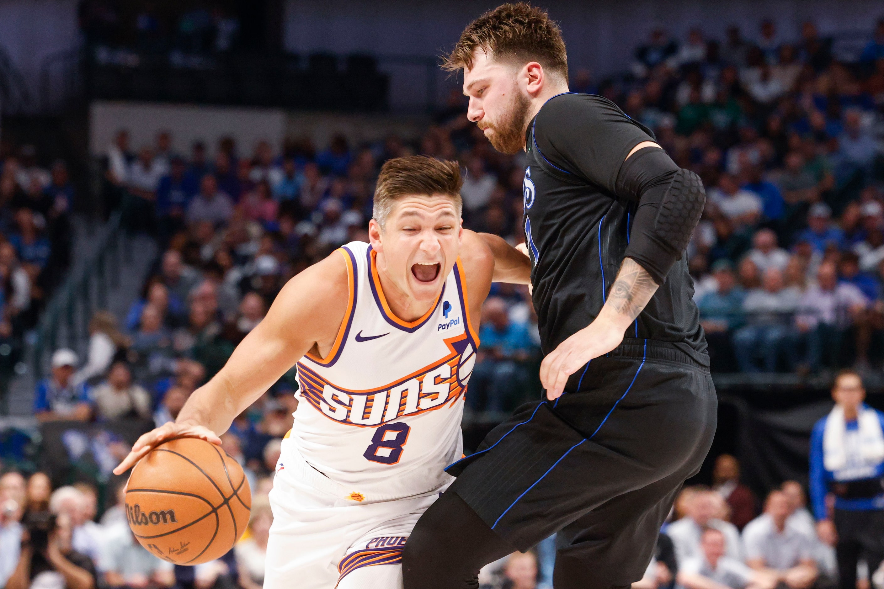 Phoenix Suns guard Grayson Allen (8) reacts after being fowled by Dallas Mavericks guard...