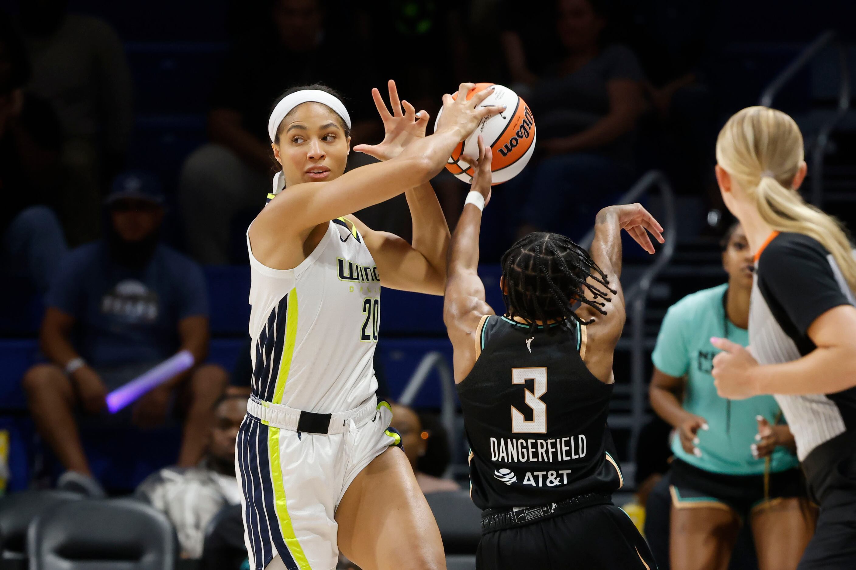 Dallas Wings forward Isabelle Harrison (20) has the ball taken by New York Liberty's Crystal...