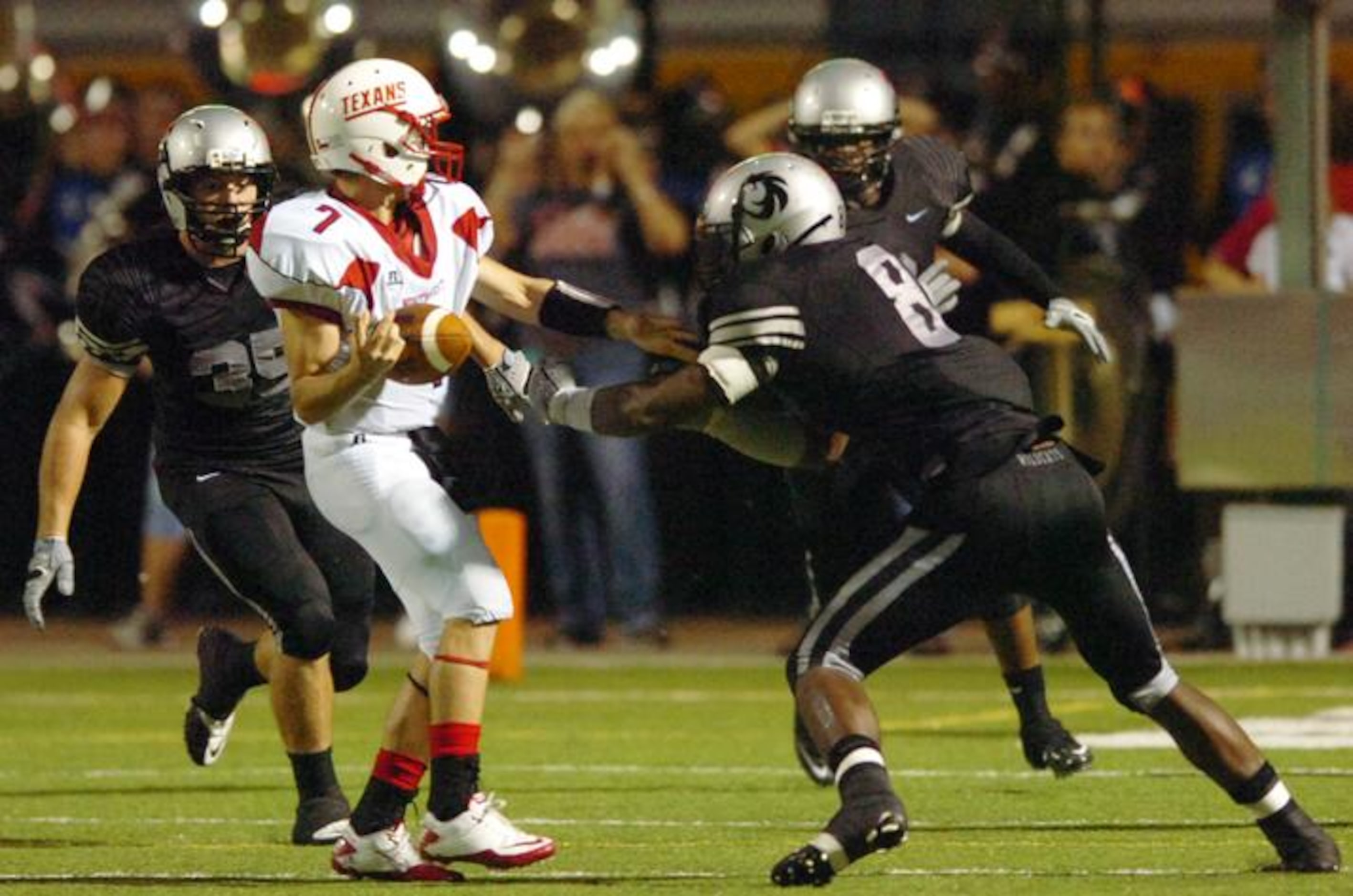 Guyer senior defensive lineman Jimmy Bean (8) rips the ball away from Justin Northwest...