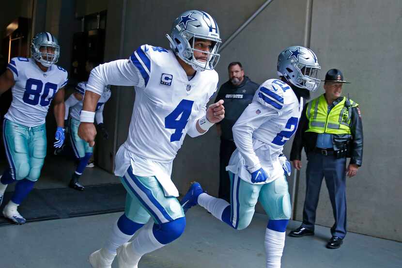 Dallas Cowboys quarterback Dak Prescott (4) and Dallas Cowboys running back Ezekiel Elliott...