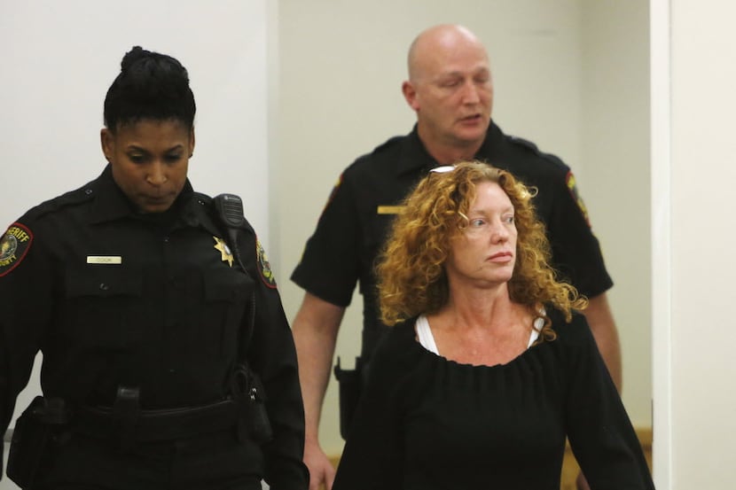 Deputies escort Tonya Couch to the defense table before her bond reduction hearing Monday,...