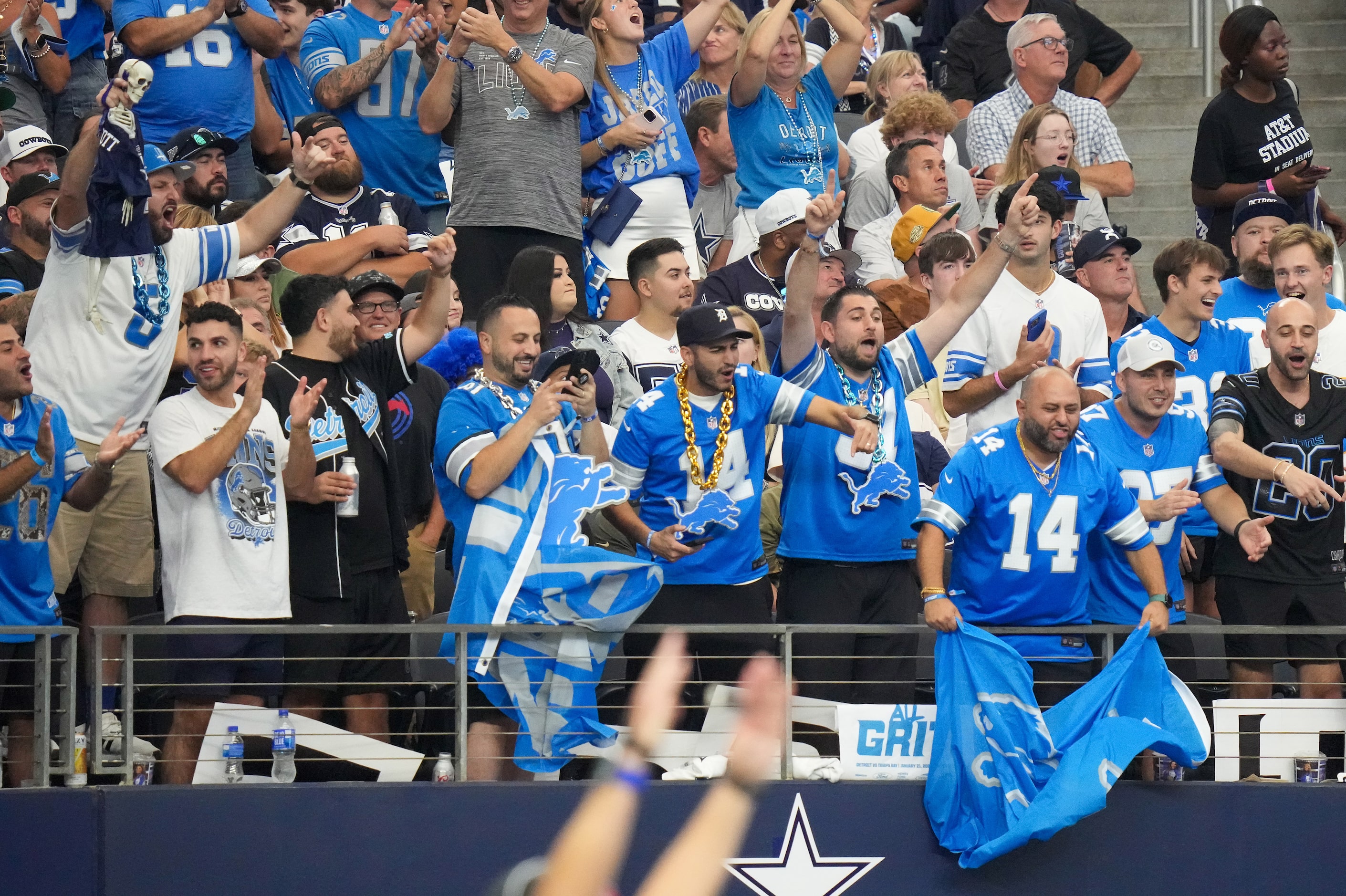 Detroit Lions fans cheer a touchdown by tight end Sam LaPorta during the first half of an...