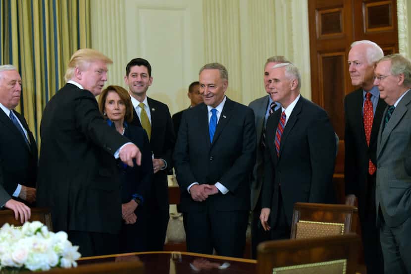 President Donald Trump speaks with congressional leaders from both parties at the White...