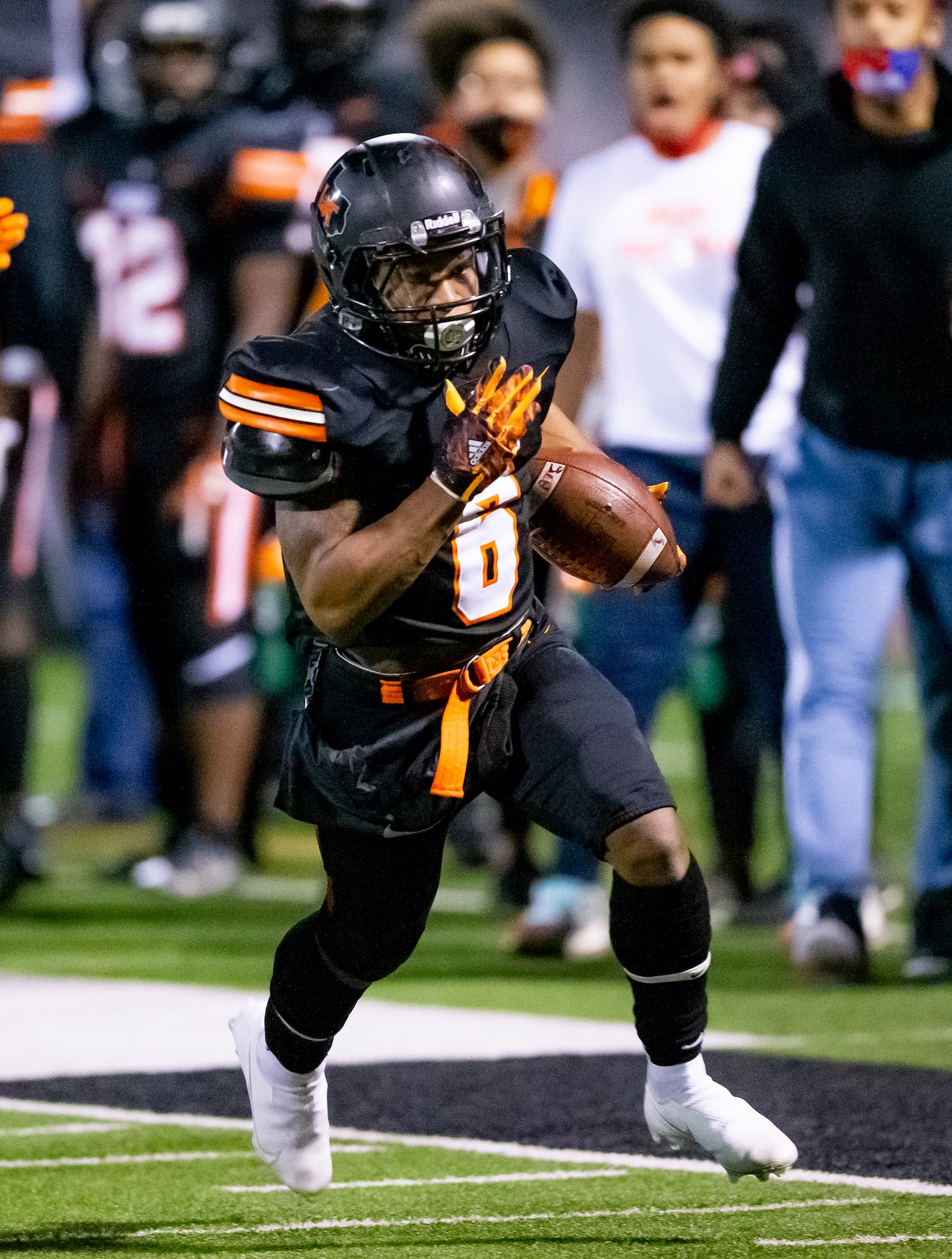 Lancaster senior running back DQ James (6) carries the ball for a touchdown during the first...