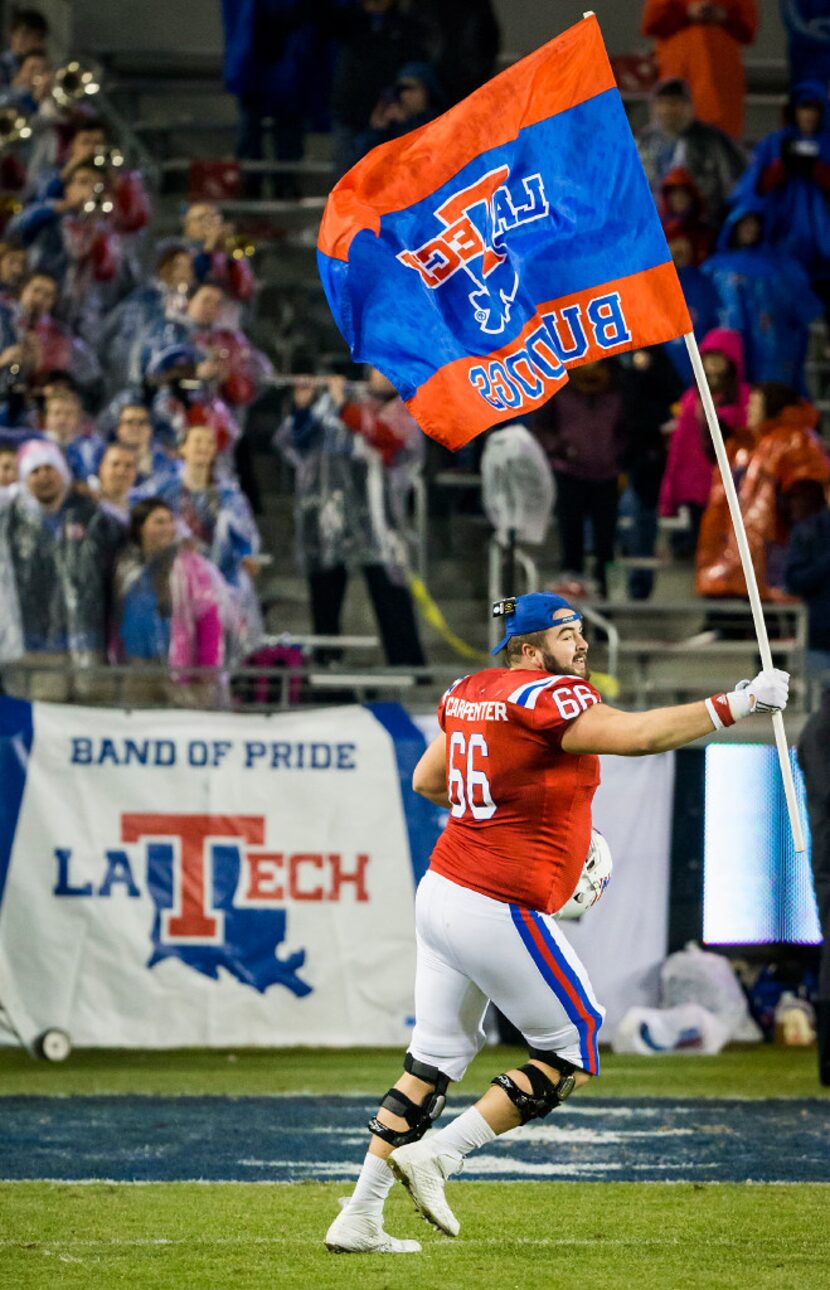 Louisiana Tech offensive lineman Shane Carpenter celebrates after the Bulldogs a 48-45...