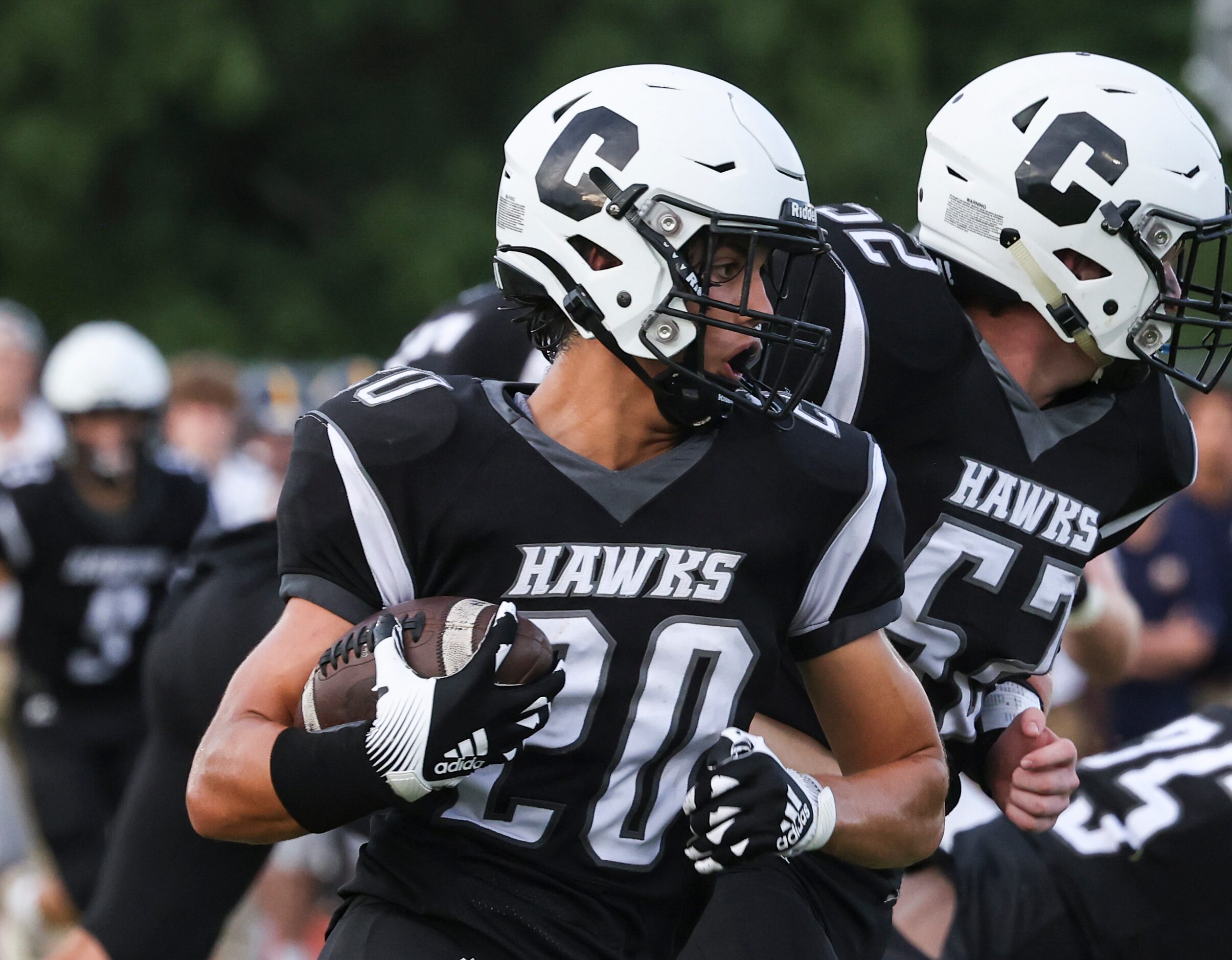 Cistercian Preparatory School, Michael Peterman (20) runs the ball up the field during the...