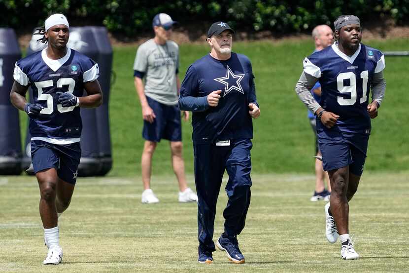 Dallas Cowboys undrafted free agent linebacker Isaiah Land (53), defensive coordinator Dan...