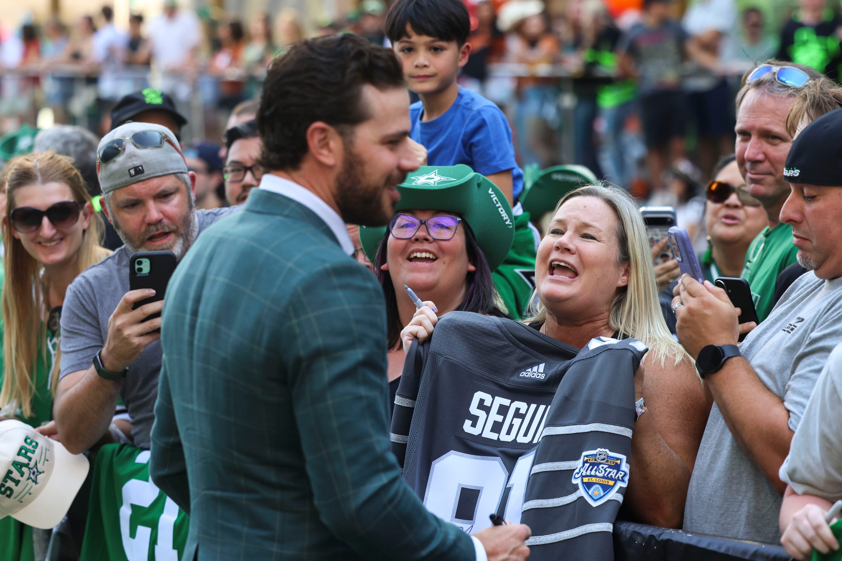 Crowd reacts as Dallas Stars center Tyler Seguin interacts during the team’s home opener...