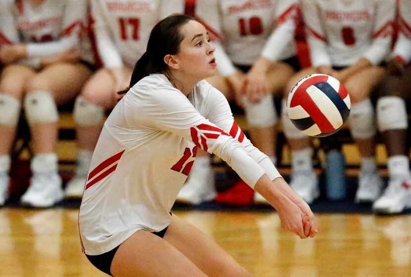 McKinney Boyd High School Avery Calame (12) receives a serve during game one as McKinney...