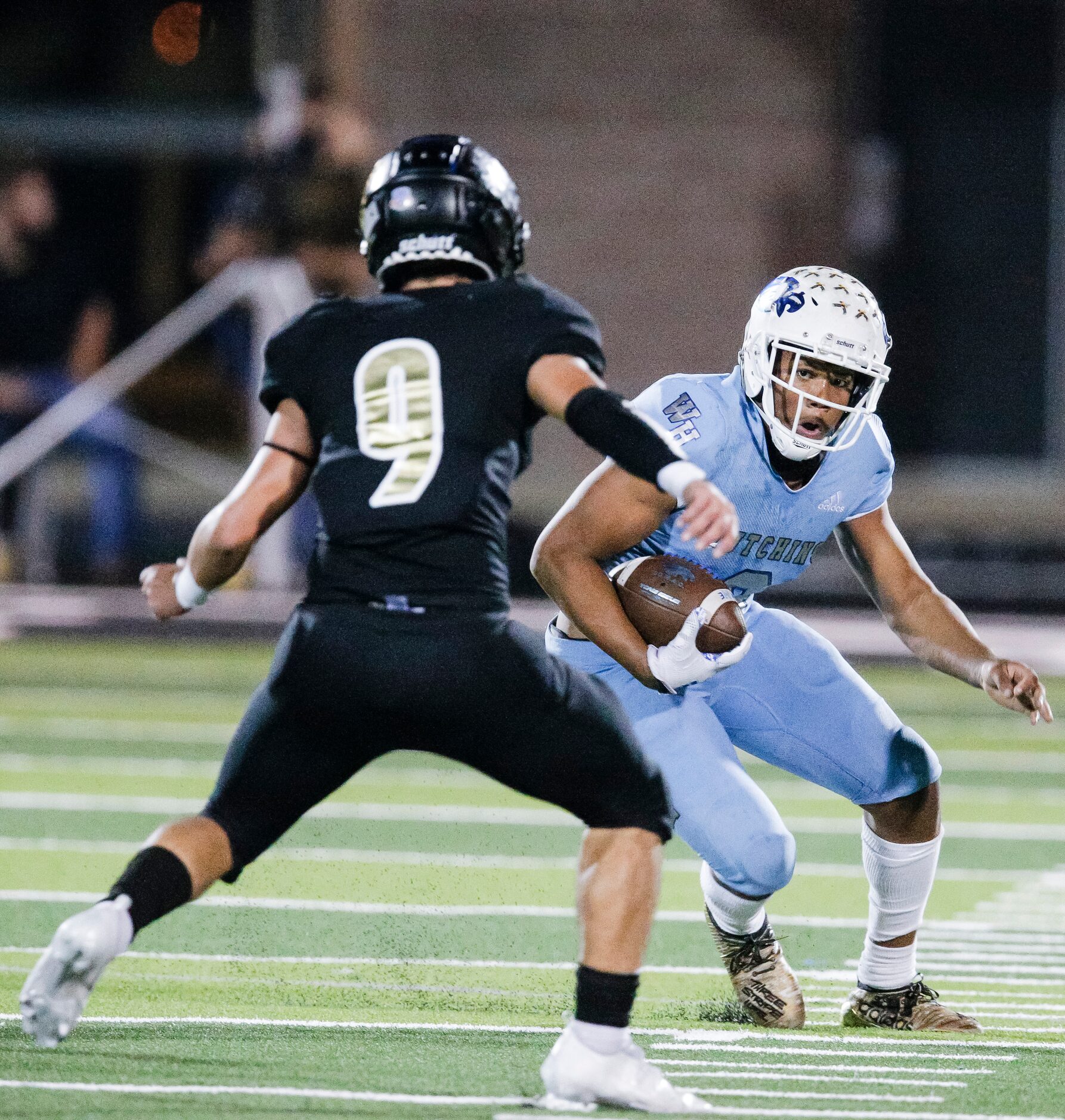 Wilmer-Hutchins senior running back Nathaniel Wright (8) looks for room against Kaufman...