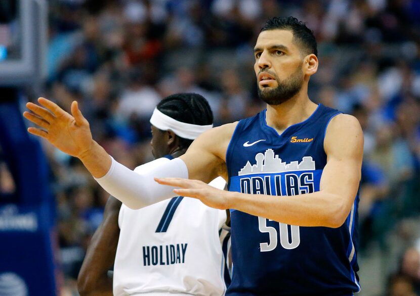 Dallas Mavericks center Salah Mejri (50) reacts after hitting a first half three-pointer...