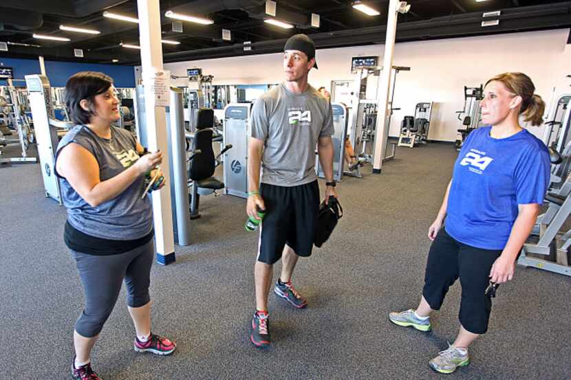 Shelly James (left)  talks with her health coach Josh Rangel (center) of Wylie and fellow...