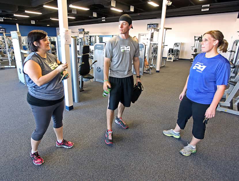 Shelly James (left)  talks with her health coach Josh Rangel (center) of Wylie and fellow...