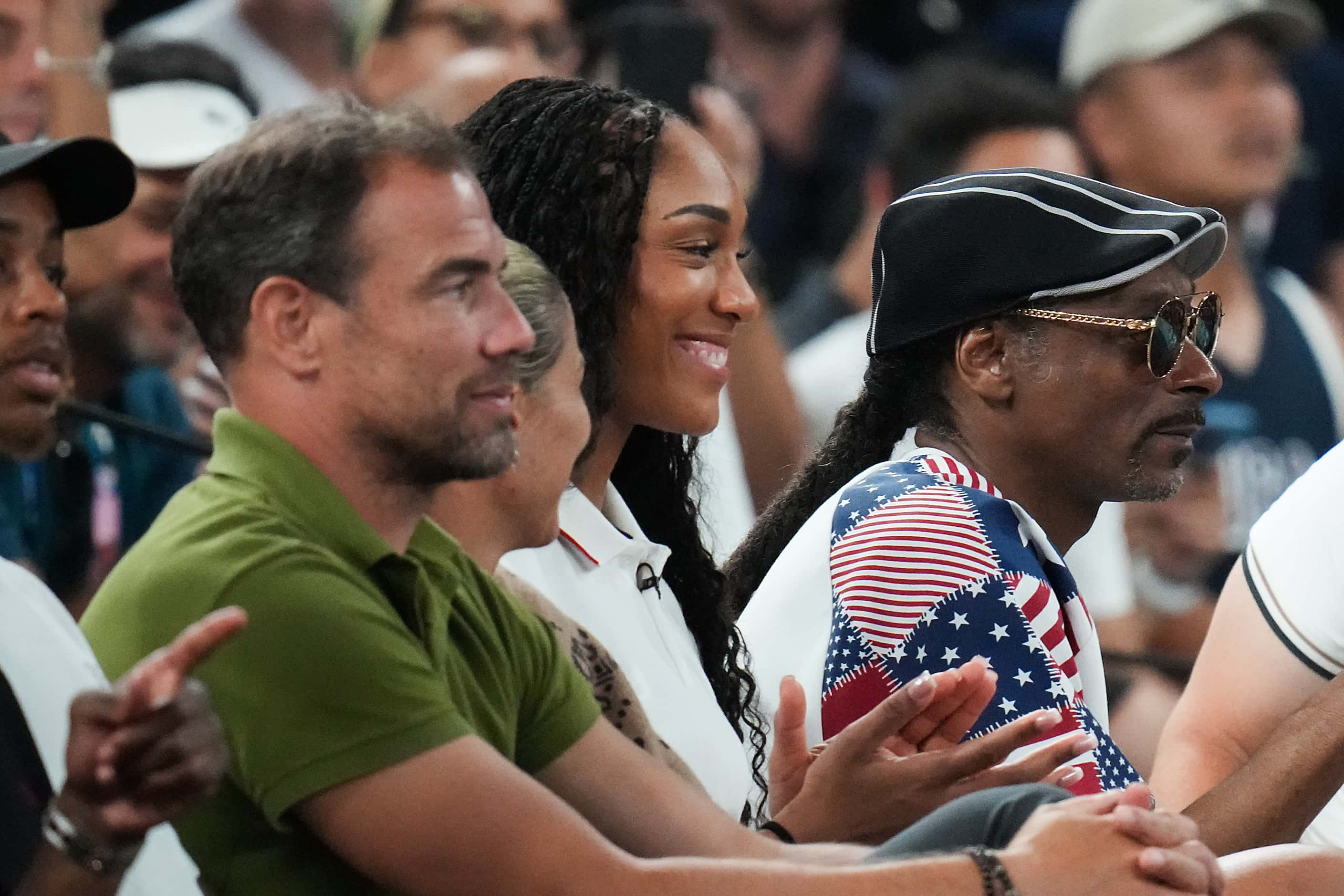 Rapper Snoop Dogg watches from courtside with USA women’s basketball star A'ja Wilson during...