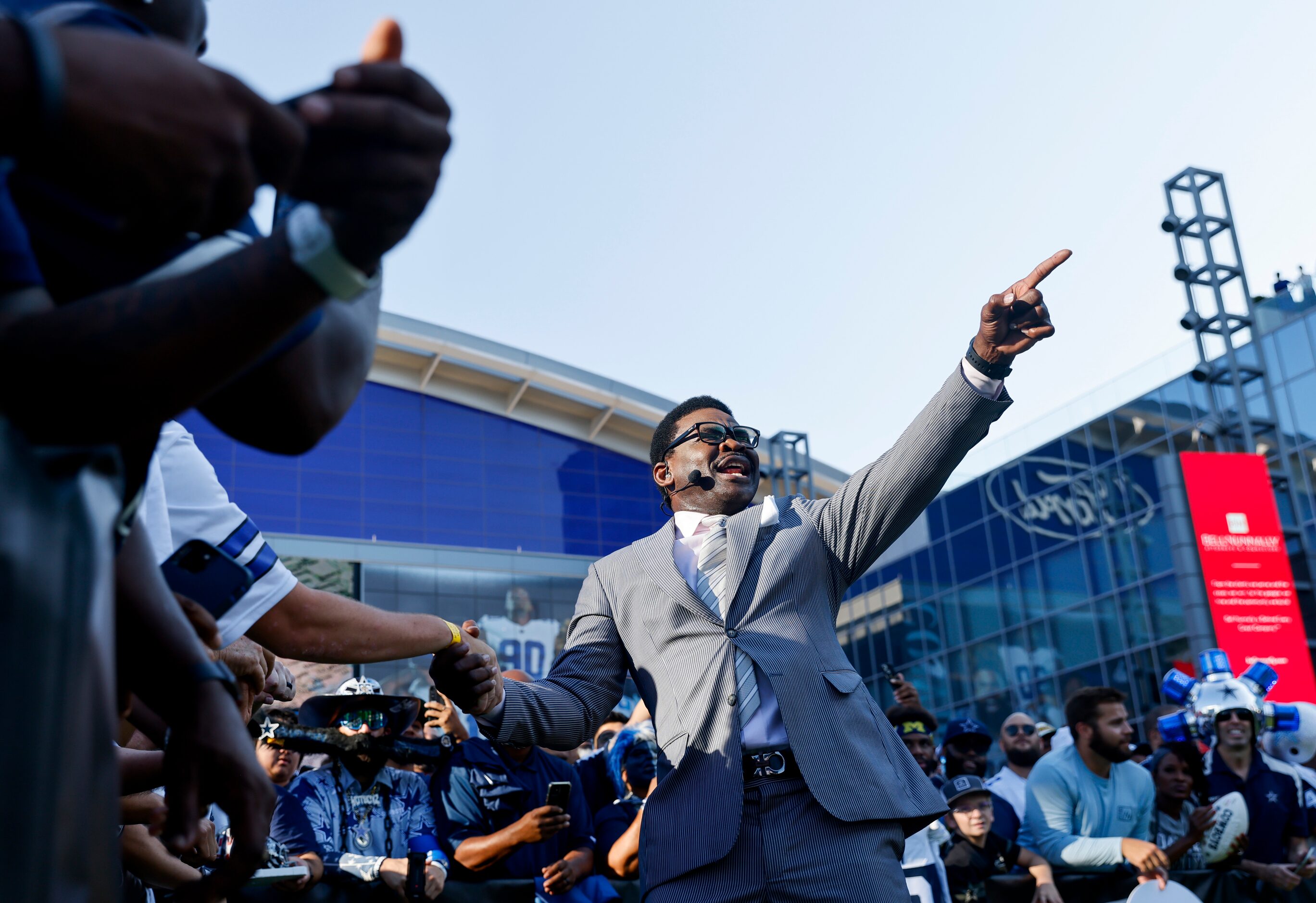 Former Dallas Cowboys player Michael Irvin reacts towards the camera during the recording of...