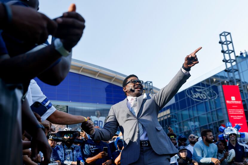 Former Dallas Cowboys player Michael Irvin reacts towards the camera during the recording of...
