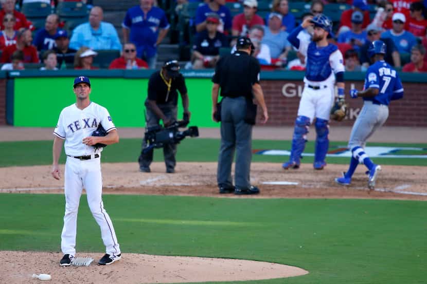 Texas Rangers starting pitcher Cole Hamels (35) looks up as Toronto Blue Jays left fielder...