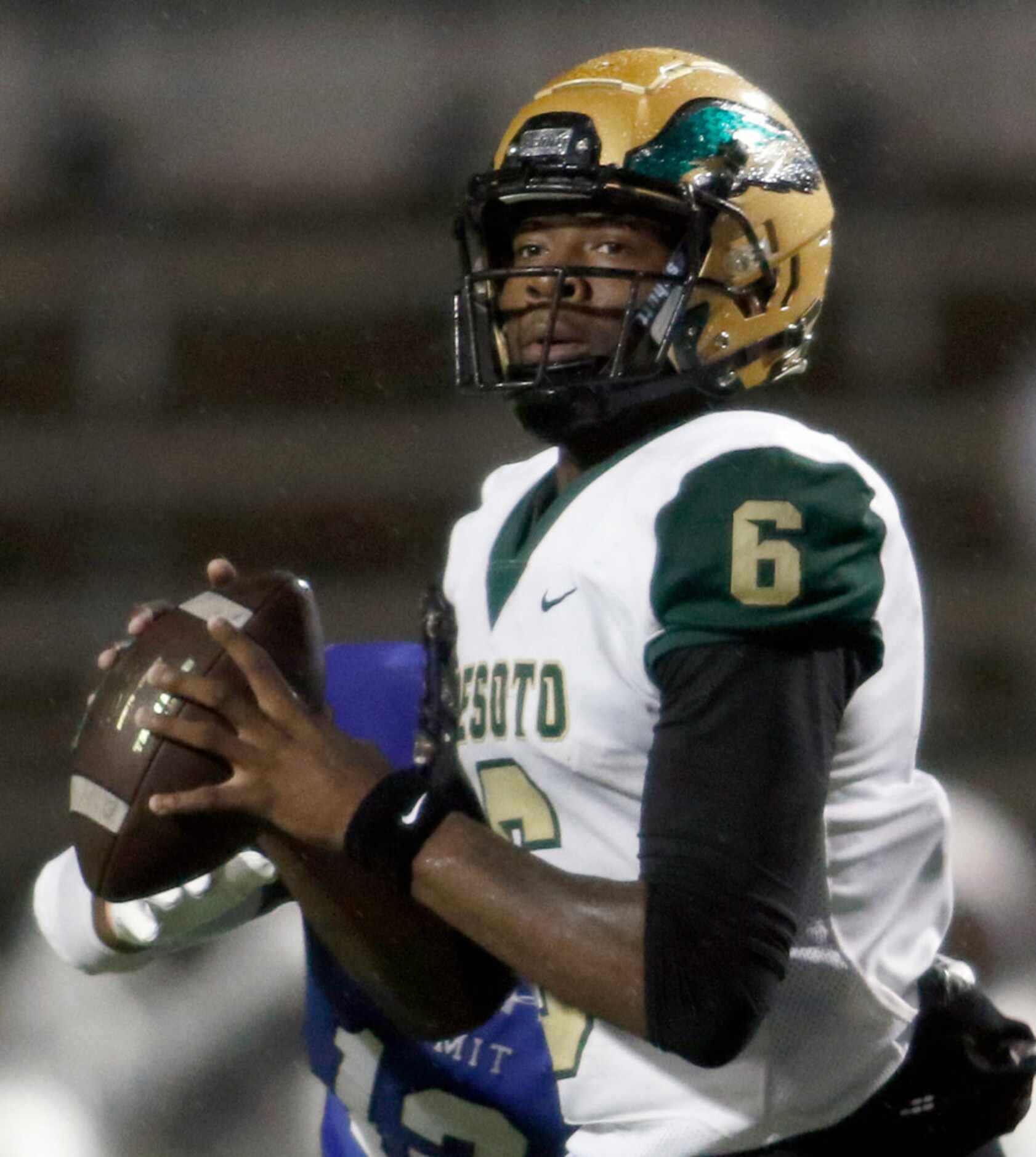 DeSoto quarterback Sami Collier (6) looks for a receiver during first half action against...