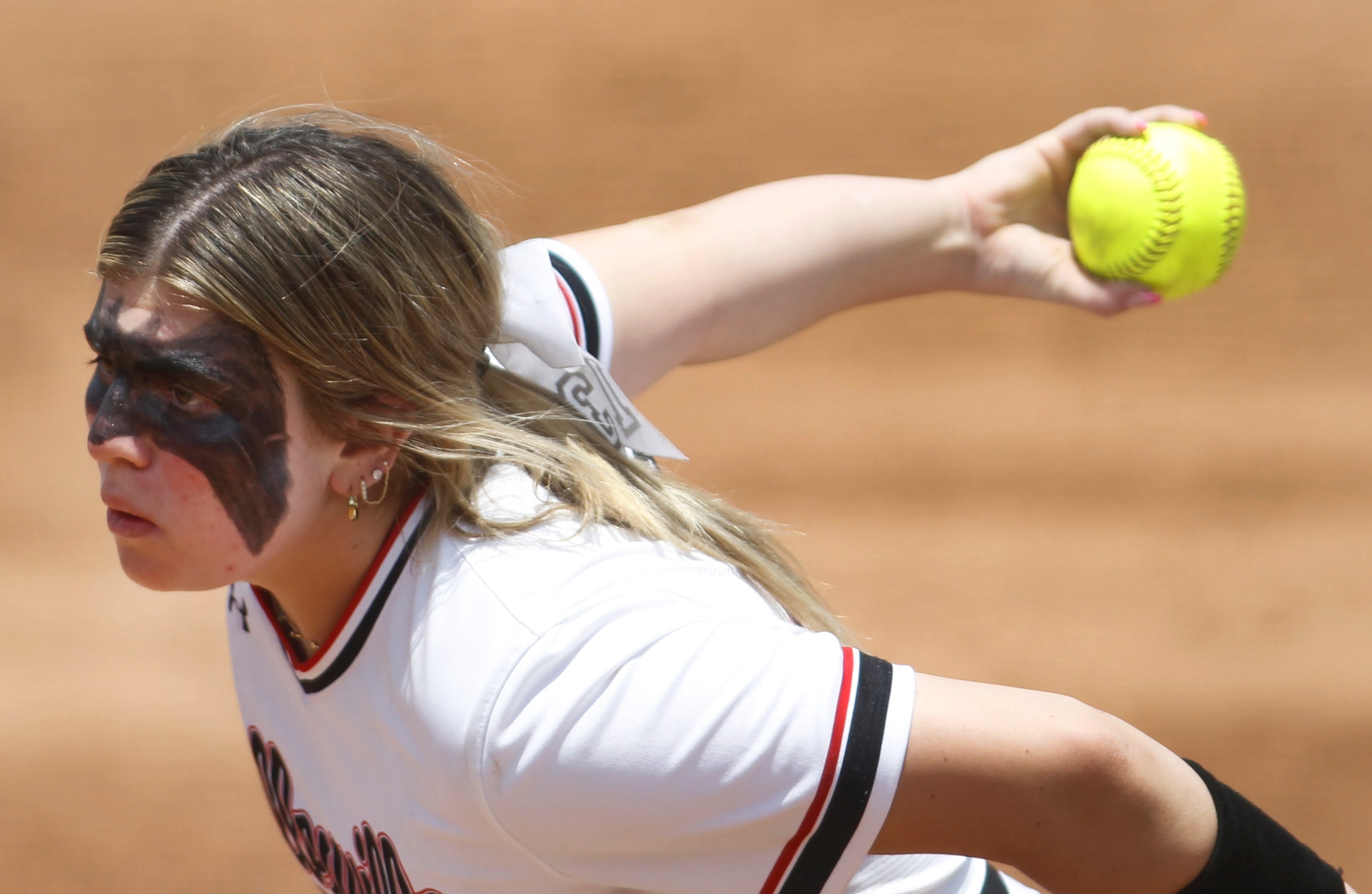 Colleyville Heritage pitcher Lindsey McConnell (13) delivers a pitch to a Comal Canyon...