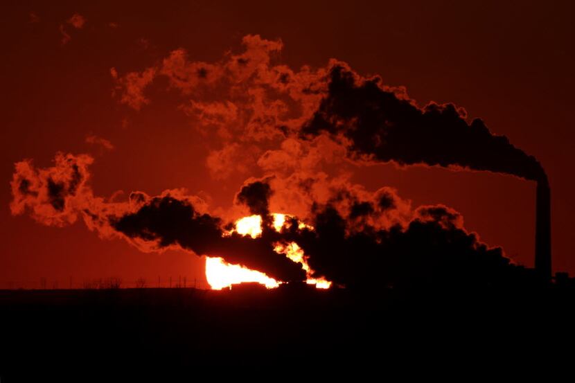 In this March 8, 2014 file photo, steam from the Jeffrey Energy Center coal-fired power...